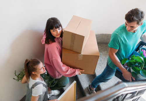 People moving with boxes